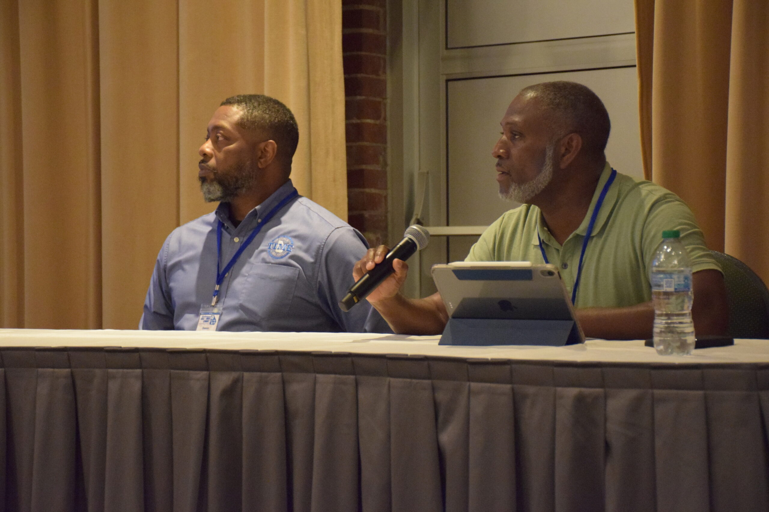 Two panelists speak at a session during the 2024 TIME Task Force Conference.