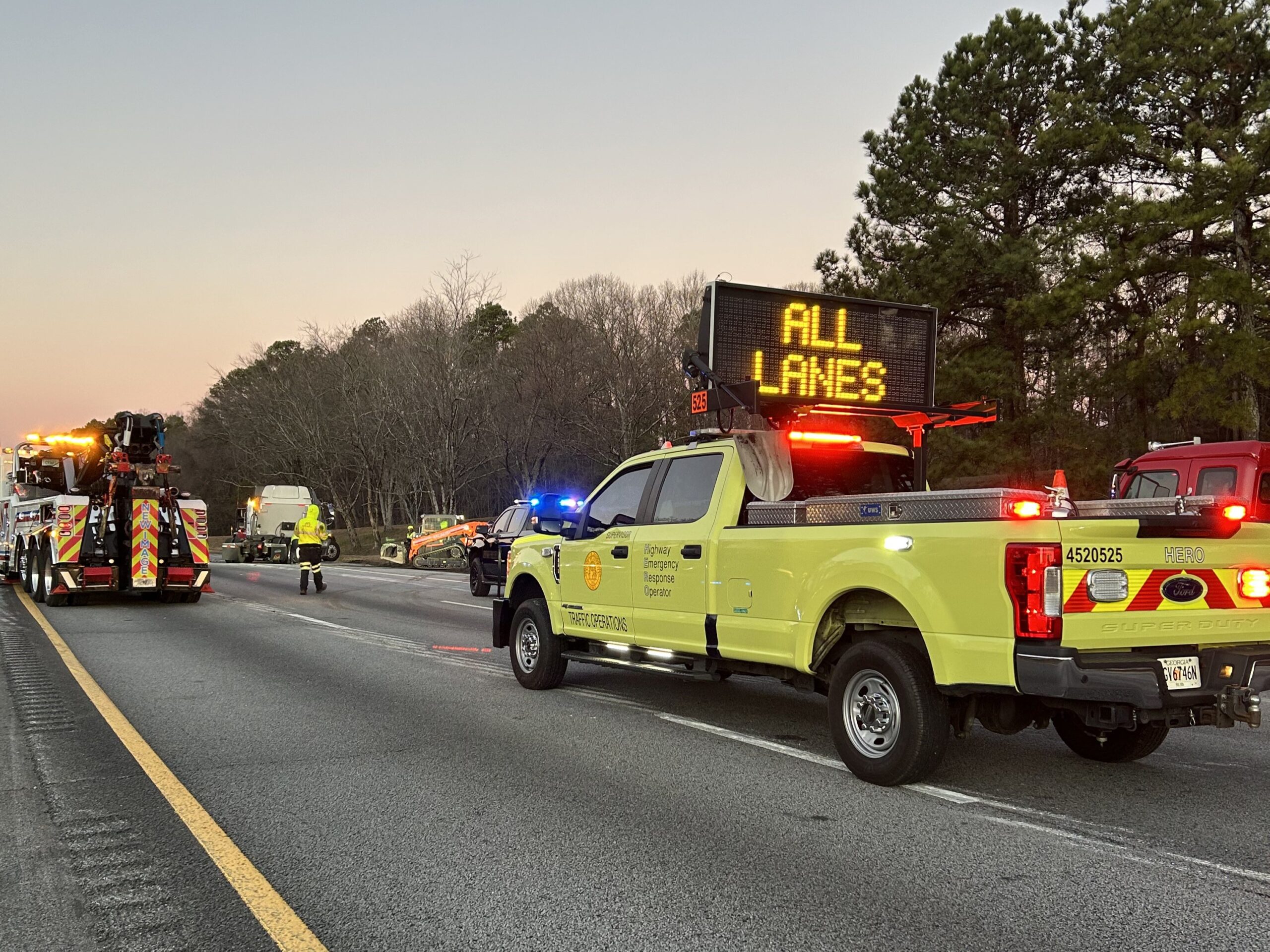 A HERO truck at an incident scene with a message sign reading "all lanes". 