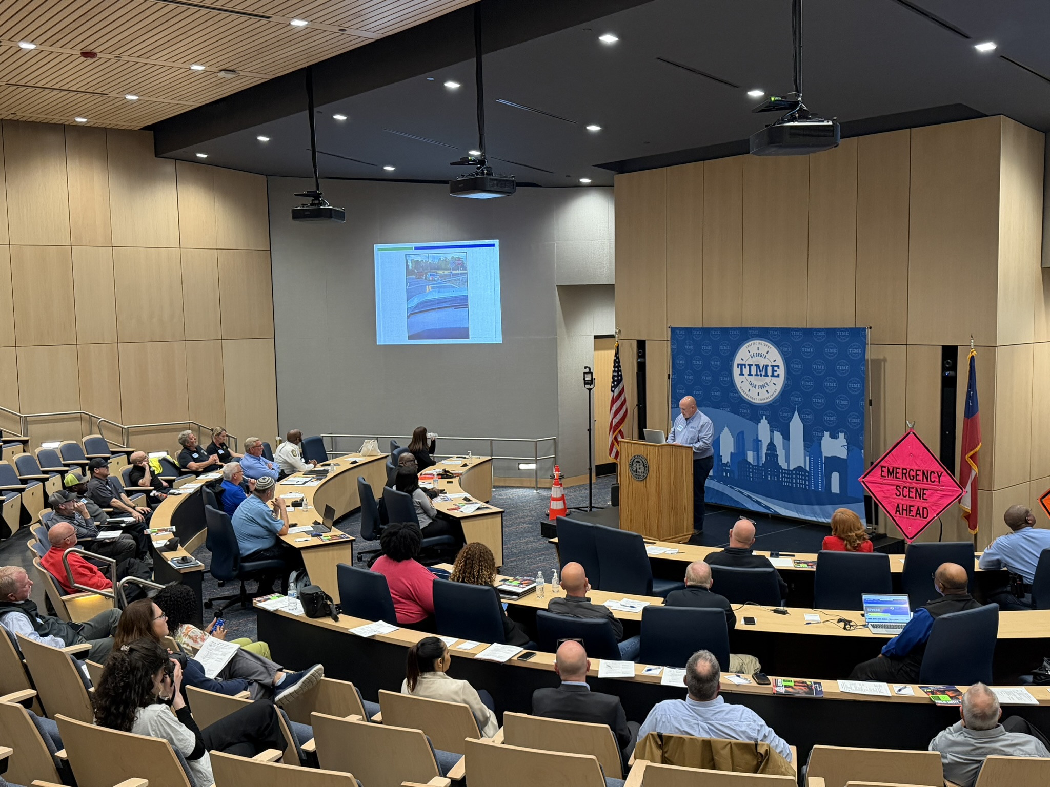 Attendees in the auditorium listening to a speaker at the 2026 in-person Q1 meeting